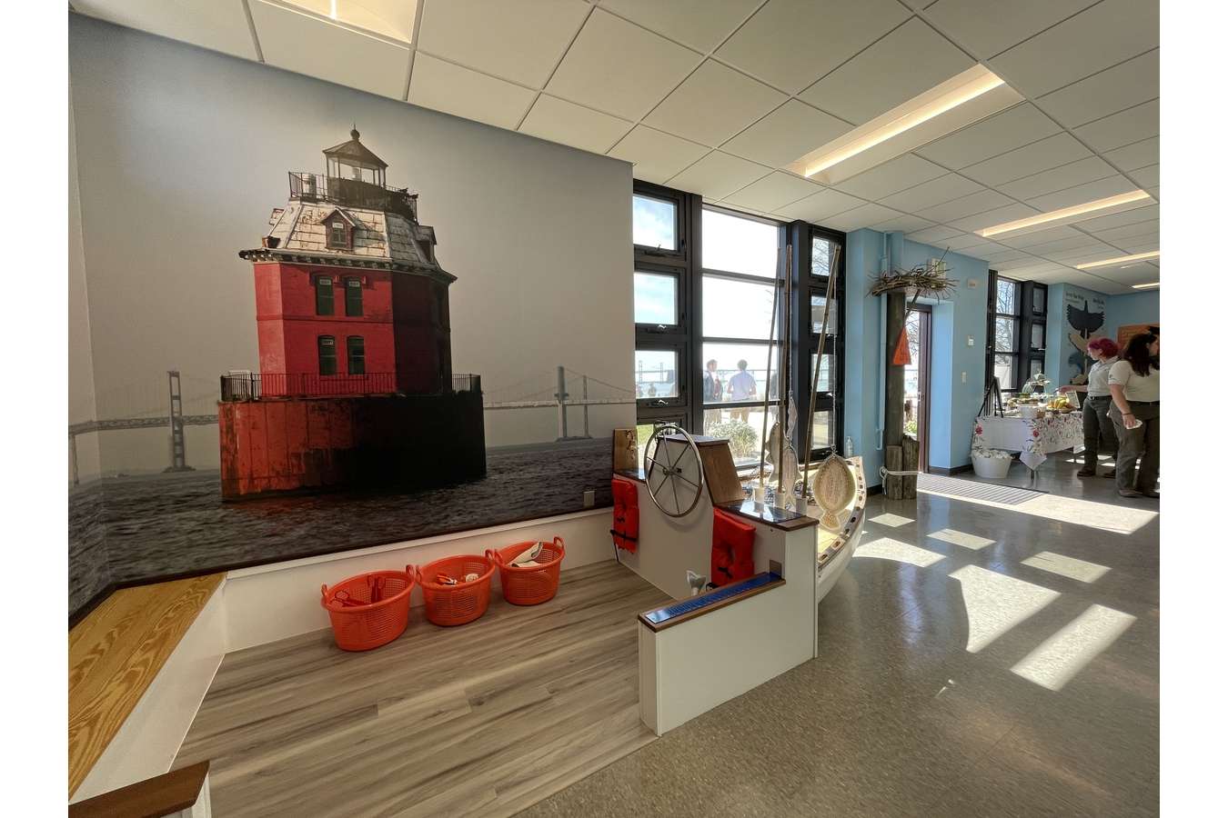 SPVC 1912 Boat East : The displays around the Sandy Point Nature Center are oriented to match the Bay view you see out the windows. The Chesapeake Bay Bridge is on right, and this light house is distant on the left.